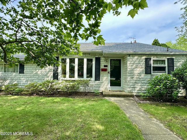 404 Harmony Rd, Middletown, NJ 07748 - view of front of house featuring stone siding, a front yard, and roof with shingles