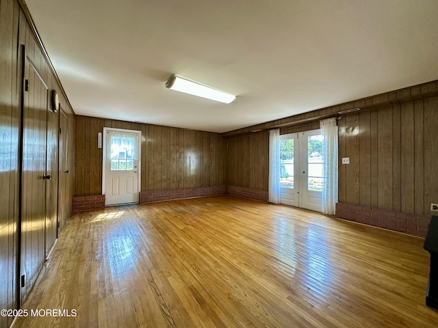 404 Harmony Rd, Middletown, NJ 07748 - spare room with light wood-style floors and wooden walls