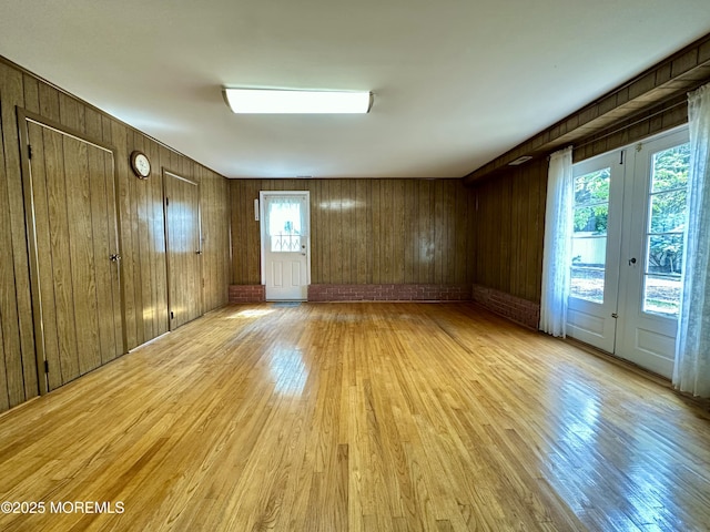 404 Harmony Rd, Middletown, NJ 07748 - empty room featuring light wood-type flooring and wooden walls
