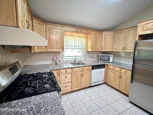 404 Harmony Rd, Middletown, NJ 07748 - kitchen with appliances with stainless steel finishes, under cabinet range hood, a sink, light brown cabinets, and vaulted ceiling