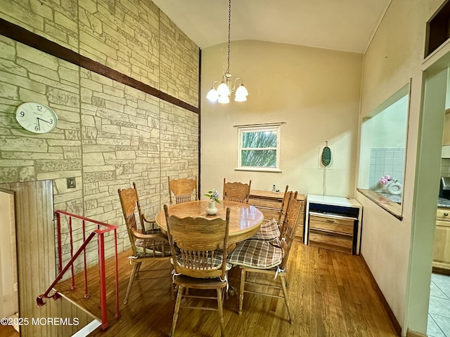 404 Harmony Rd, Middletown, NJ 07748 - dining space with lofted ceiling, wood finished floors, and a chandelier