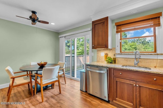 3 Stratton Pl, New Monmouth, NJ 07748 - kitchen featuring stainless steel dishwasher, a sink, crown molding, brown cabinetry, and light wood-style floors