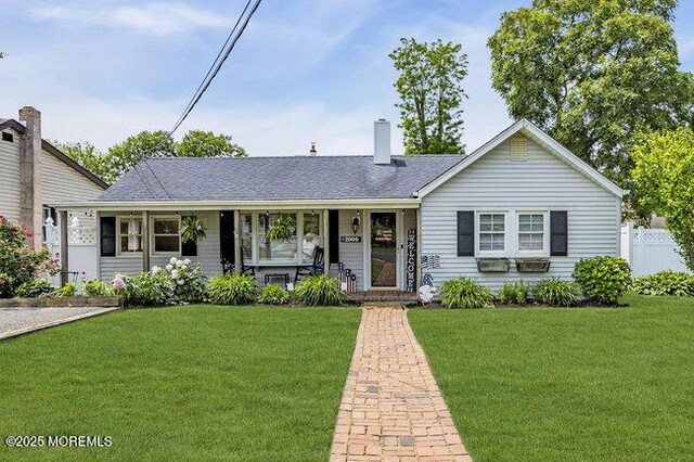 2909 Arthur St, Wall, NJ 07719 - view of front facade featuring a porch and a chimney