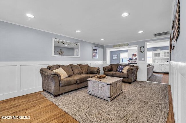 2909 Arthur St, Wall, NJ 07719 - living area featuring ornamental molding, wainscoting, light wood-style flooring, and recessed lighting