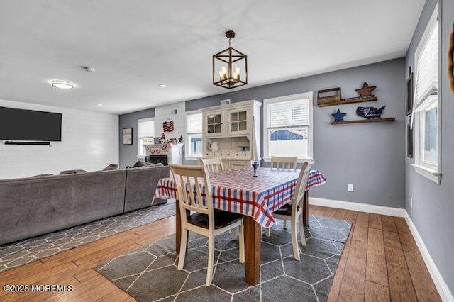 2909 Arthur St, Wall, NJ 07719 - dining space featuring hardwood / wood-style flooring and a chandelier