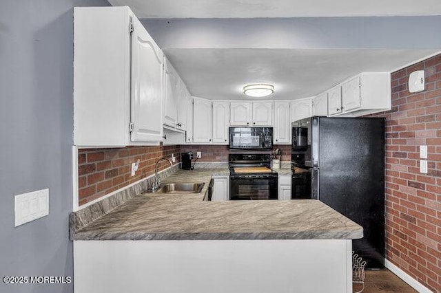 2909 Arthur St, Wall, NJ 07719 - kitchen featuring black appliances, brick wall, a peninsula, white cabinetry, and dark wood-style flooring