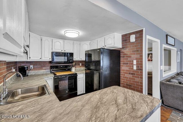 2909 Arthur St, Wall, NJ 07719 - kitchen featuring black appliances, white cabinets, backsplash, and light countertops
