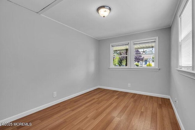 2909 Arthur St, Wall, NJ 07719 - spare room with healthy amount of natural light, light wood-type flooring, and attic access