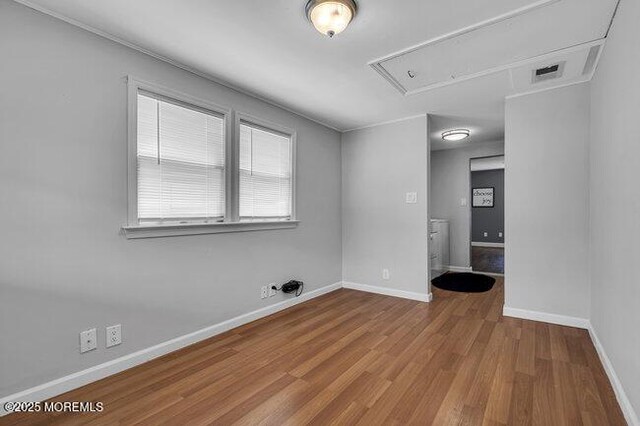 2909 Arthur St, Wall, NJ 07719 - empty room featuring attic access and wood finished floors