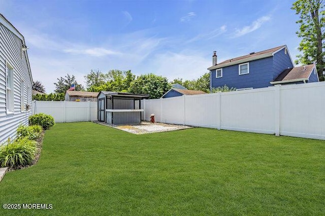2909 Arthur St, Wall, NJ 07719 - fenced backyard featuring a storage shed