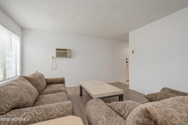 58 Amberly Dr Unit E, Manalapan, NJ 07726 - living area featuring wood finished floors, a wall mounted AC, and baseboards
