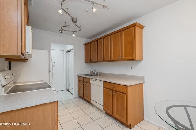 58 Amberly Dr Unit E, Manalapan, NJ 07726 - kitchen featuring white appliances, a sink, light tile patterned floors, and light countertops