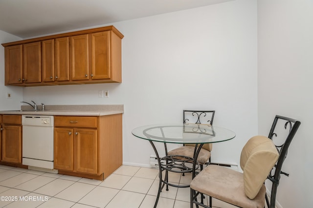 58 Amberly Dr Unit E, Manalapan, NJ 07726 - kitchen featuring dishwasher, light countertops, a sink, brown cabinets, and light tile patterned floors