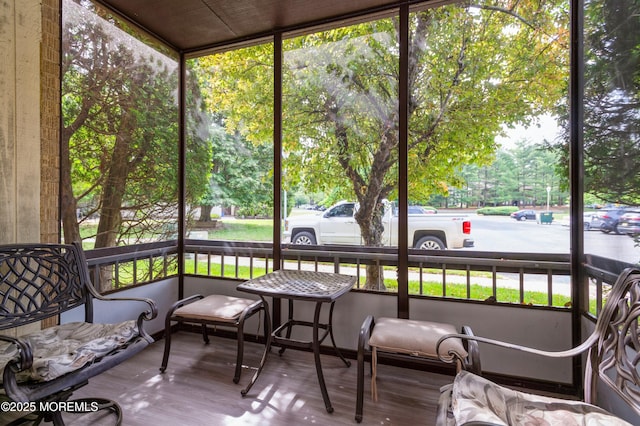 58 Amberly Dr Unit E, Manalapan, NJ 07726 - sunroom featuring healthy amount of natural light and view of scattered trees