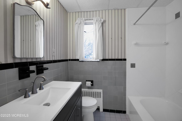 283 Spring St Unit 283B, Red Bank, NJ 07701 - full bathroom with radiator, wallpapered walls, tile patterned floors, tile walls, and vanity