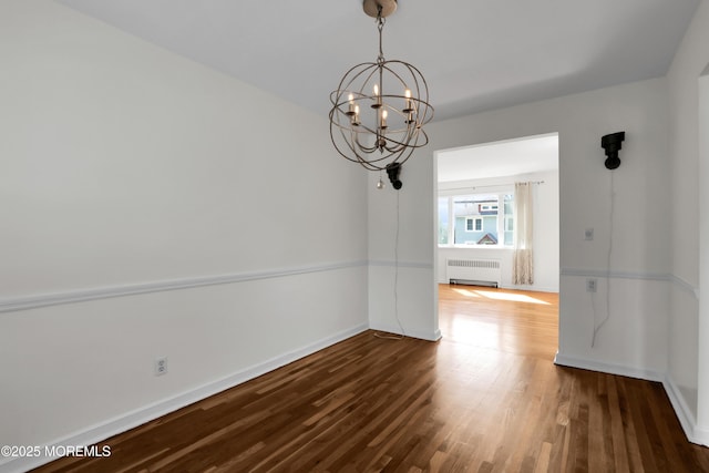 283 Spring St Unit 283B, Red Bank, NJ 07701 - unfurnished dining area with radiator heating unit, a chandelier, wood finished floors, and baseboards