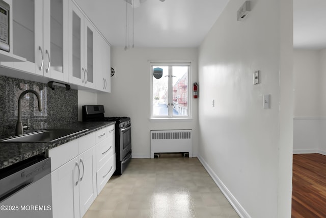 283 Spring St Unit 283B, Red Bank, NJ 07701 - kitchen with radiator heating unit, appliances with stainless steel finishes, a sink, glass insert cabinets, and backsplash