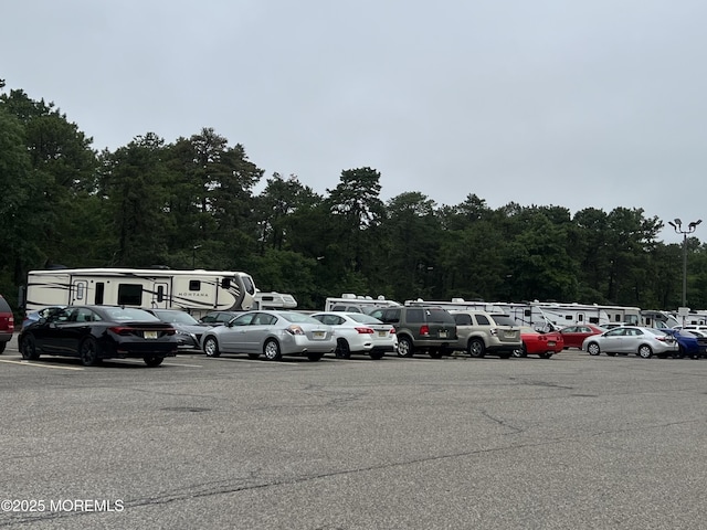 59B Cambridge Cir, Manchester, NJ 08759 - uncovered parking lot featuring a view of trees
