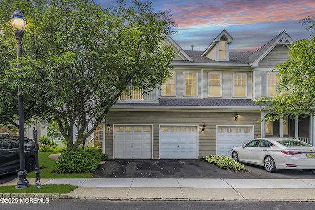 66 Shore Dr Unit 20, South Amboy, NJ 08879 - view of property with driveway, an attached garage, and roof with shingles