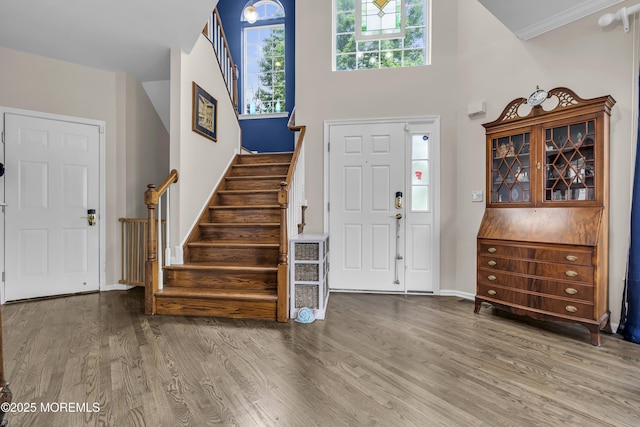 66 Shore Dr Unit 20, South Amboy, NJ 08879 - foyer entrance featuring stairs, wood finished floors, a towering ceiling, and baseboards