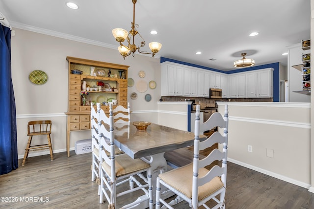 66 Shore Dr Unit 20, South Amboy, NJ 08879 - dining space with a chandelier, recessed lighting, light wood-style flooring, baseboards, and crown molding