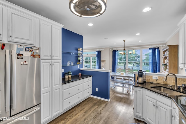66 Shore Dr Unit 20, South Amboy, NJ 08879 - kitchen with freestanding refrigerator, a sink, wood finished floors, white cabinetry, and ornamental molding