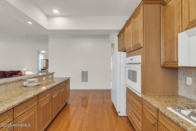 39 Barton Creek Rd, Jackson, NJ 08527 - kitchen featuring white appliances, backsplash, light wood-style flooring, light stone countertops, and recessed lighting