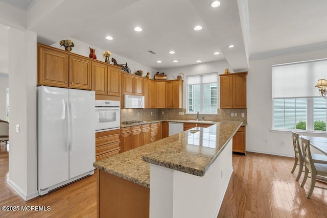 39 Barton Creek Rd, Jackson, NJ 08527 - kitchen featuring white appliances, light wood finished floors, recessed lighting, decorative backsplash, and a center island