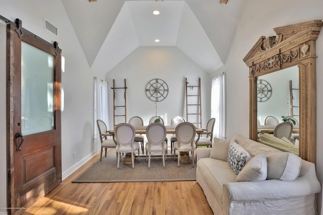 142 Heck Ave, Ocean Grove, NJ 07756 - dining area featuring vaulted ceiling, light wood-type flooring, a barn door, baseboards, and recessed lighting