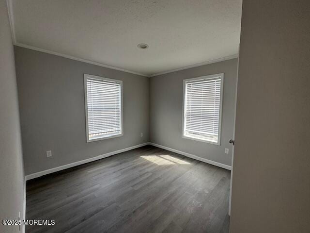 12 Mary Ann Ct, Hazlet, NJ 07734 - spare room with ornamental molding, dark wood finished floors, baseboards, and plenty of natural light