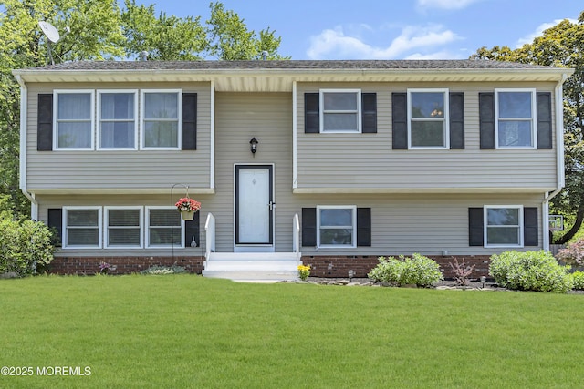 7 Juniper Ln, Jackson, NJ 08527 - split foyer home featuring a front lawn and brick siding
