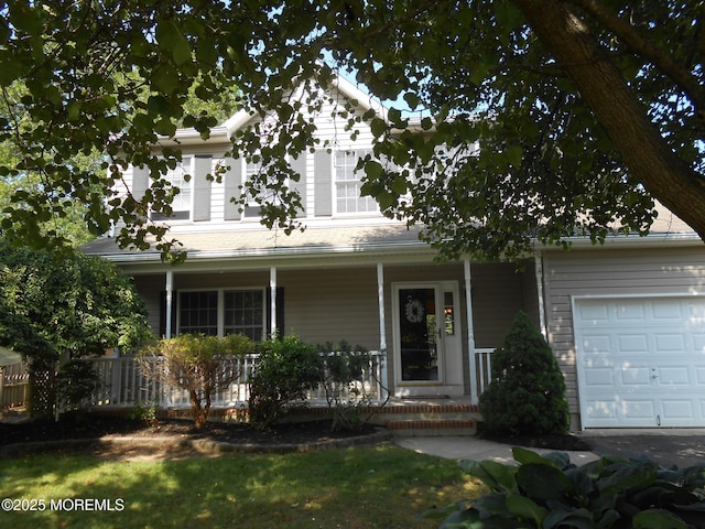 483 Coral Ln, Manahawkin, NJ 08050 - view of front of home with covered porch and a garage