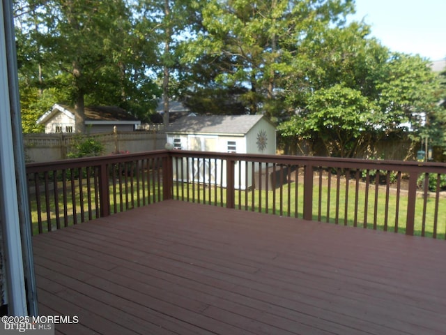 483 Coral Ln, Manahawkin, NJ 08050 - wooden terrace featuring a fenced backyard and a storage shed