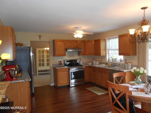 483 Coral Ln, Manahawkin, NJ 08050 - kitchen featuring appliances with stainless steel finishes, under cabinet range hood, a chandelier, dark wood-style flooring, and pendant lighting