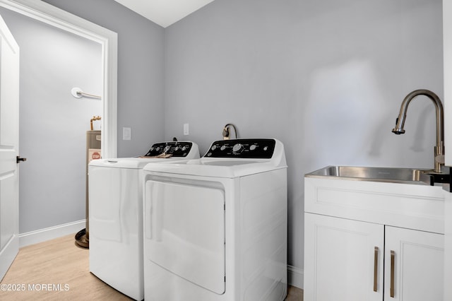 1172 Concord Dr, Brick, NJ 08724 - washroom featuring cabinet space, separate washer and dryer, baseboards, and light wood-style floors