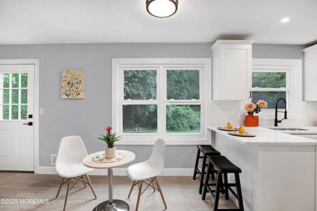1172 Concord Dr, Brick, NJ 08724 - dining area featuring light wood-type flooring, plenty of natural light, baseboards, and recessed lighting