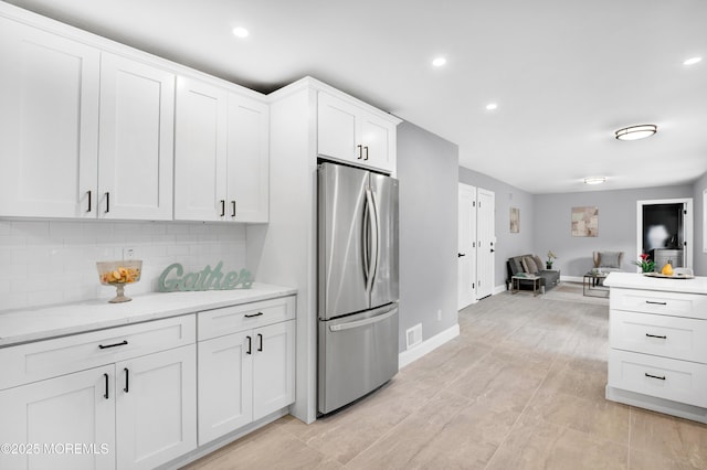 1172 Concord Dr, Brick, NJ 08724 - kitchen featuring freestanding refrigerator, tasteful backsplash, white cabinetry, baseboards, and open floor plan