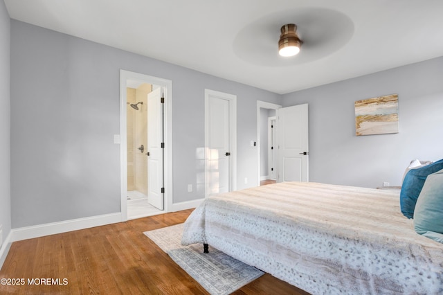 1172 Concord Dr, Brick, NJ 08724 - bedroom with wood finished floors, baseboards, and ensuite bathroom