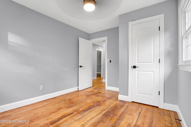1172 Concord Dr, Brick, NJ 08724 - unfurnished bedroom with wood finished floors, baseboards, and ceiling fan