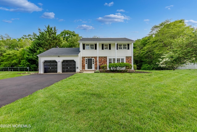 1172 Concord Dr, Brick, NJ 08724 - view of front of house with an attached garage, driveway, and a front yard