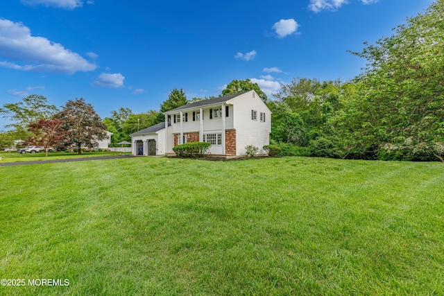 1172 Concord Dr, Brick, NJ 08724 - view of front of house with an attached garage, a front lawn, and asphalt driveway