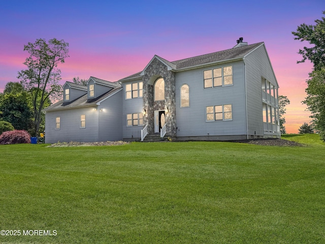 6 Marc Ln, North Hanover, NJ 08562 - view of front facade featuring a lawn, a chimney, and stone siding