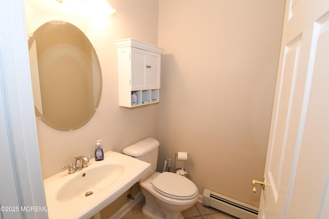 6 Marc Ln, North Hanover, NJ 08562 - bathroom featuring a baseboard radiator, a sink, toilet, and tile patterned flooring