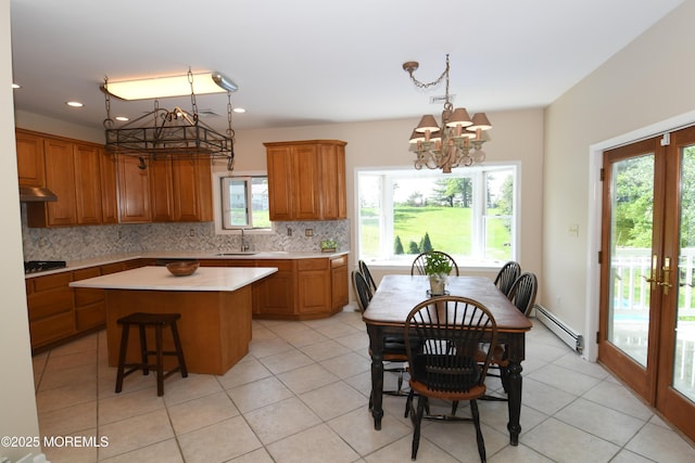 6 Marc Ln, North Hanover, NJ 08562 - dining space featuring a chandelier, baseboard heating, light tile patterned floors, recessed lighting, and french doors