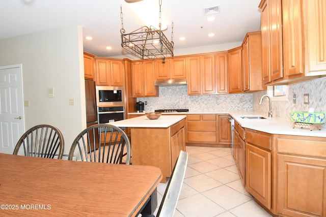 6 Marc Ln, North Hanover, NJ 08562 - kitchen featuring a sink, appliances with stainless steel finishes, under cabinet range hood, a center island, and light countertops