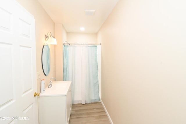 6 Marc Ln, North Hanover, NJ 08562 - bathroom featuring vanity, wood finished floors, and a shower with curtain