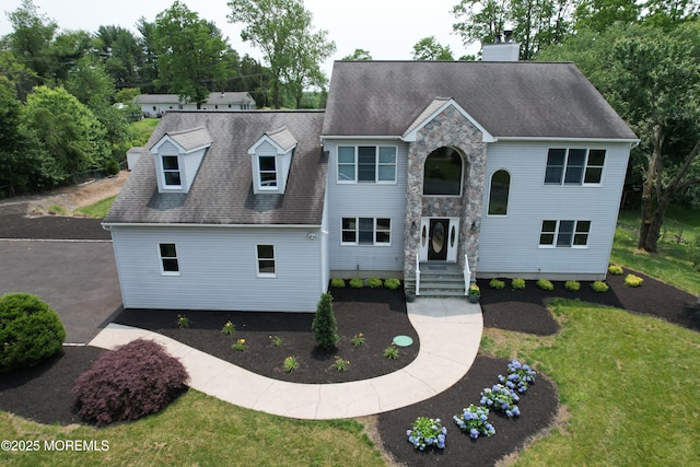 6 Marc Ln, North Hanover, NJ 08562 - view of front of house with a chimney, a front lawn, stone siding, and a shingled roof