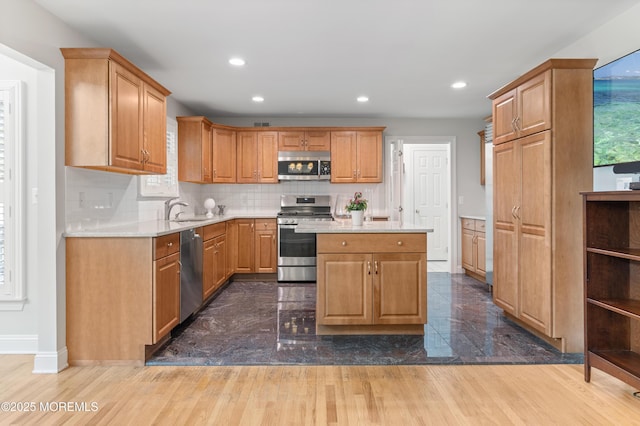 34 Peach Tree Ln, Little Silver, NJ 07739 - kitchen with stainless steel appliances, light countertops, recessed lighting, tasteful backsplash, and a kitchen island