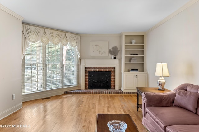 34 Peach Tree Ln, Little Silver, NJ 07739 - living area with wood finished floors, a brick fireplace, and crown molding