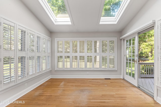 34 Peach Tree Ln, Little Silver, NJ 07739 - unfurnished sunroom with a skylight, wood finished floors, and lofted ceiling